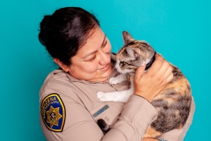 Officer holding cat